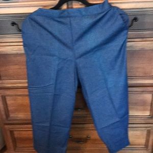 Alfred dunner navy capris with two side pockets and elastic waist in back .